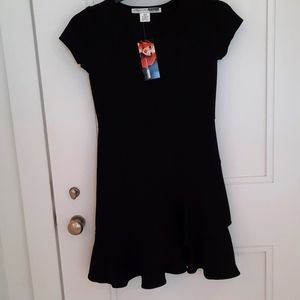 Black Crepe Dress slanted ruffle on the bottom. Size Large